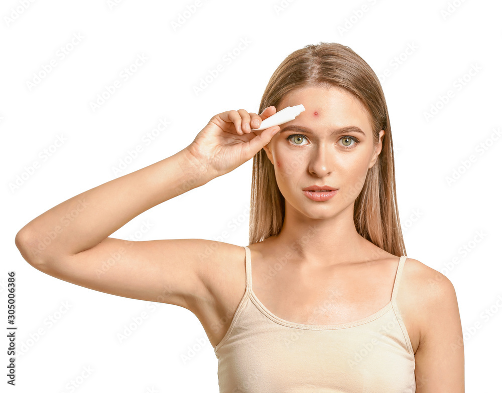Portrait of young woman with remedy for acne on white background Portrait of young woman with remedy for acne on white background