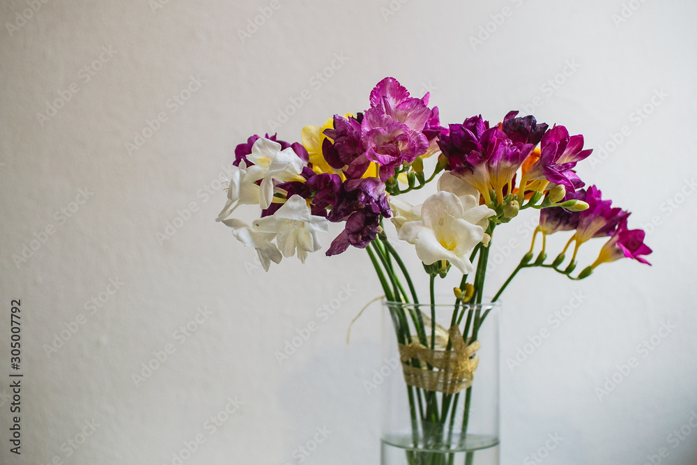 beautiful multi-colored alstroemeria bouquet in a glass vase