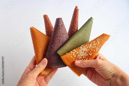 Slice of colourful handmade sweets on white background photo