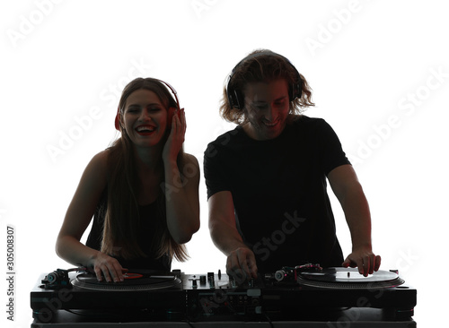 Silhouette of young djs playing music on white background