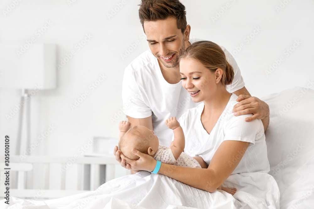 Young family with newborn baby in maternity hospital Young family with newborn baby in maternity hospital