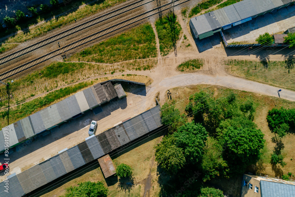Aerial view on railroads and car garages during sunny summer time