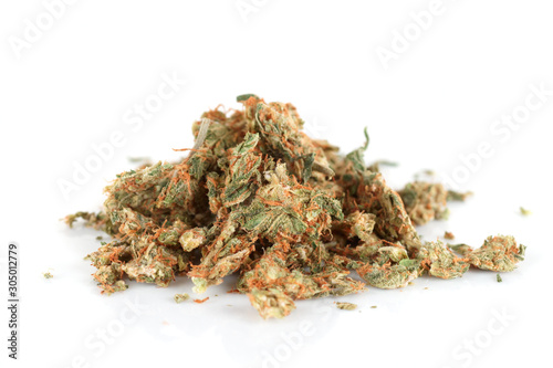 Street drug: pressed marijuana buds isolated on white