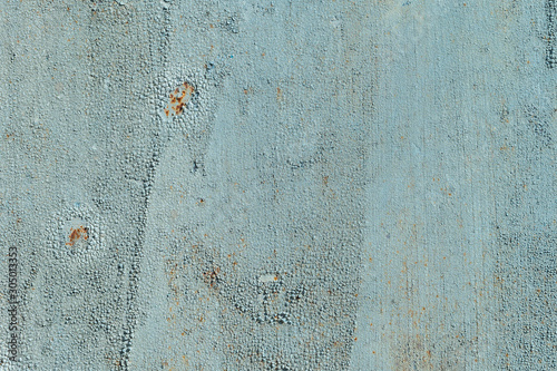 Light blue faded. Texture of stained metal surface with cracked paint with cracked paint. Finely detailed background