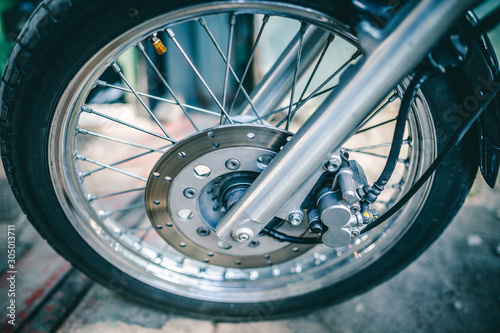 Close up view on wheel and spokes of motorcycle