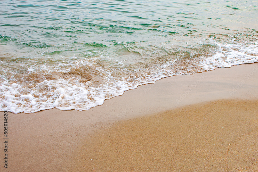 Beautiful white sand beach by the sea, clear blue sky and soft waves. Beautiful white sand beach by the sea, clear blue sky and soft waves.