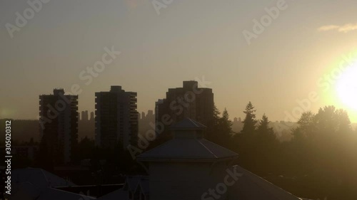 A Glimpse Of Vancouver City While Travelling In The Famous Millennium Line On A Glowing Sunrise - Medium Shot photo