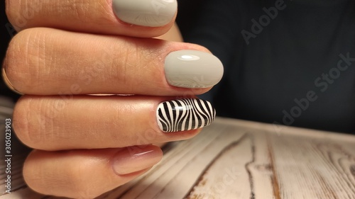 stylish design of manicure on beautiful nails