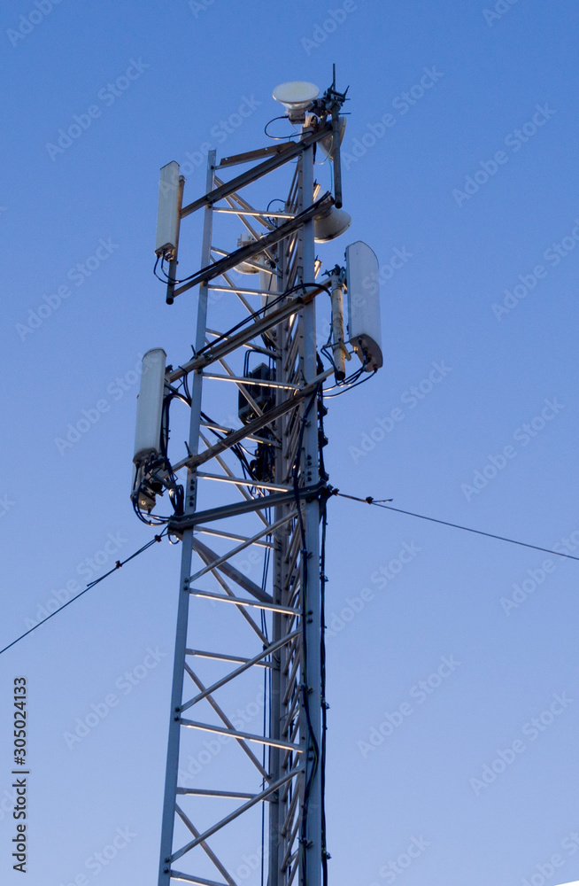 cell tower on blue sky background cell tower on blue sky background