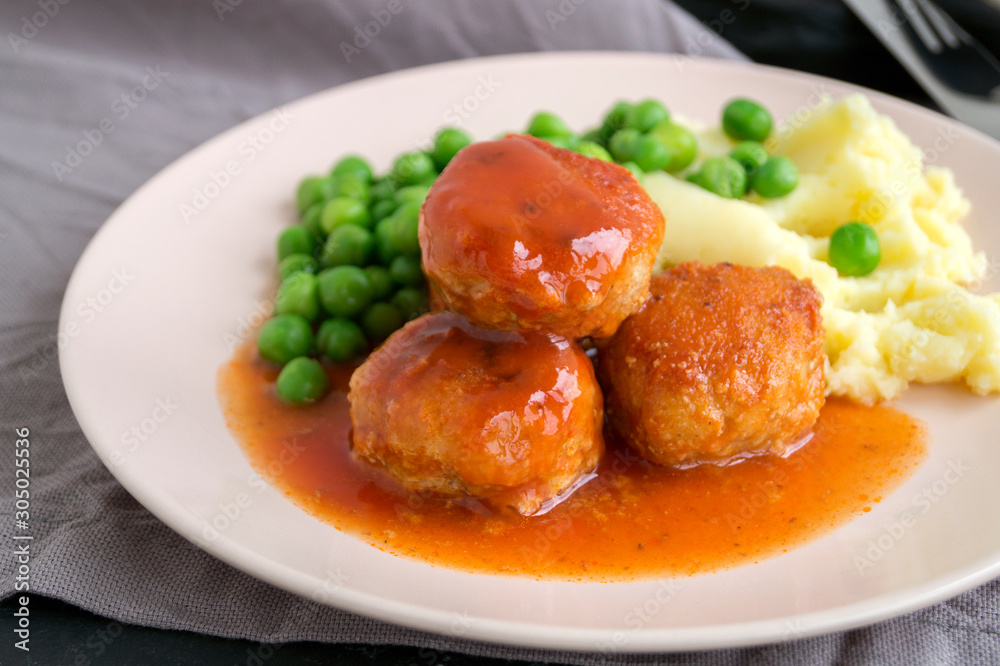 Meatballs in sweet and sour tomato sauce with mashed potatoes. Meatballs in sweet and sour tomato sauce with mashed potatoes.