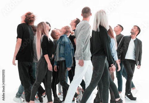 Photography casual young people looking somewhere up. isolated on white