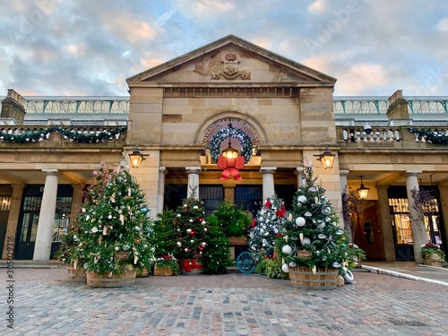 Christmas trees and holiday decorations outside of Covent Garden Market, in central London photo