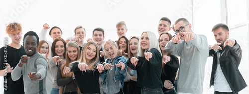 group of confident young people pointing at you photo