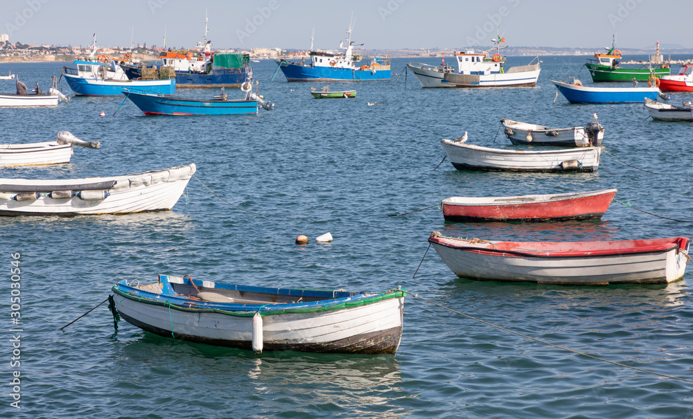 Scenic seascape with colorful fishing boats moored in harbor