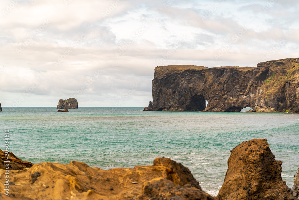 Reynisfjara Beach view. Rock formation with a gate