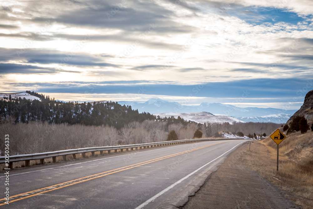 Beautiful sunset over a rural highway into the mountains. Beautiful sunset over a rural highway into the mountains.