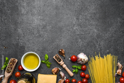 Italian food, ingredients of spaghetti: pasta, parmesan, olive oil, basil