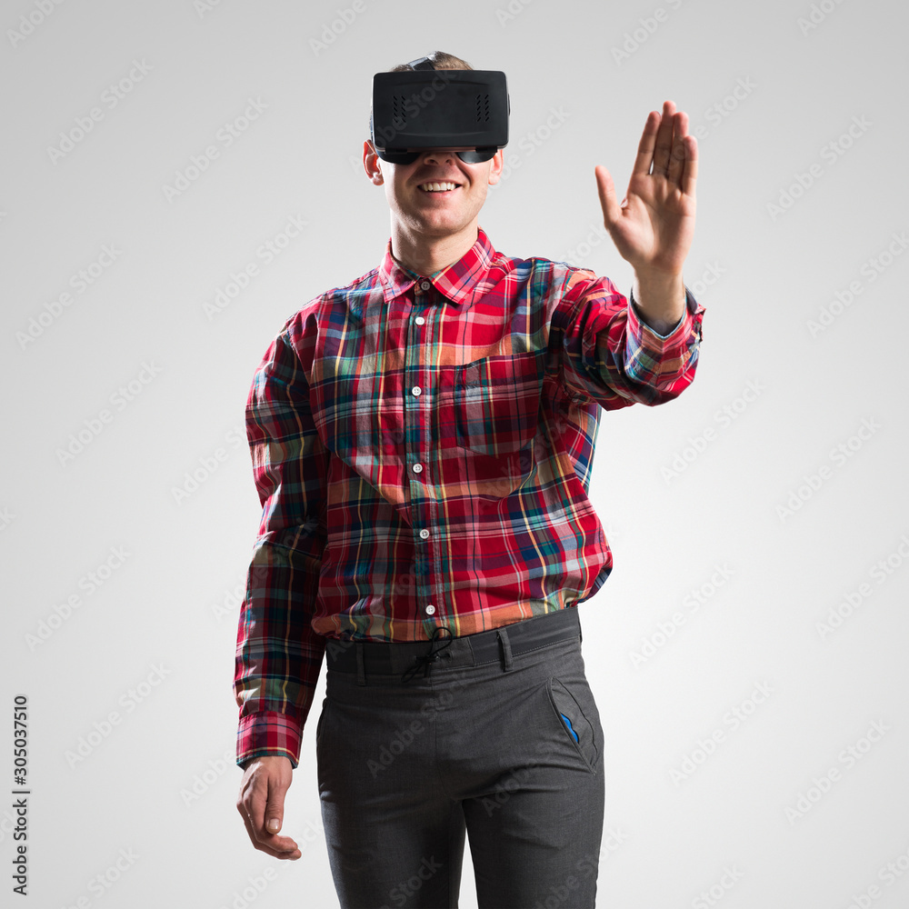 Guy in mask experiencing virtual reality as new entertainment device Guy in mask experiencing virtual reality as new entertainment device