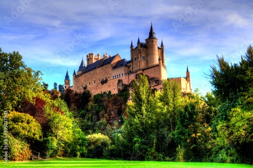 Segovia, Spain. The famous Alcazar of Segovia, rising out on a rocky crag, built in 1120. photo