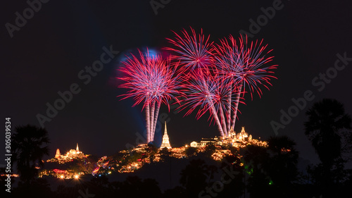 Beautiful colorful fireworks festival over the Phra Nakhon Khiri Historical Park on mountain in night time at Phetchaburi, Thailand