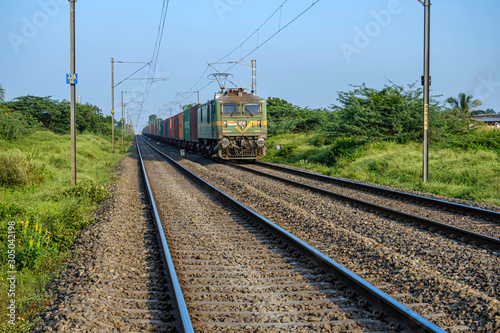 Pune, India - November 10 2019: Freight train hauled by an electric locomotive Pune India.