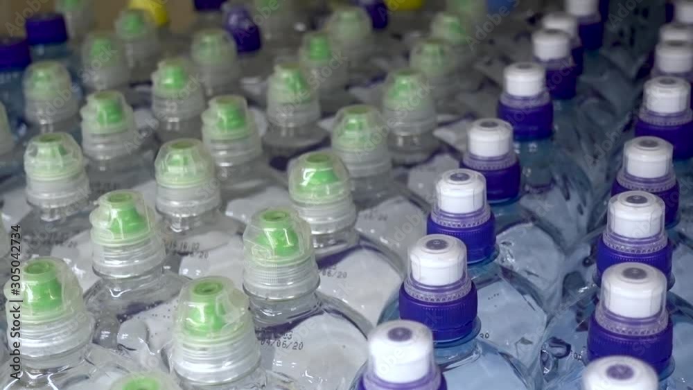 Lid plastic water bottle in the market. multi-colored plastic bottle caps Lid plastic water bottle in the market. multi-colored plastic bottle caps