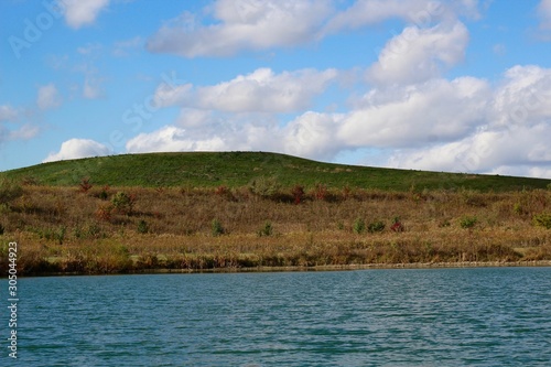 A lakeside view of the lake and the hill landscape.