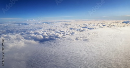 a landscape above the clouds