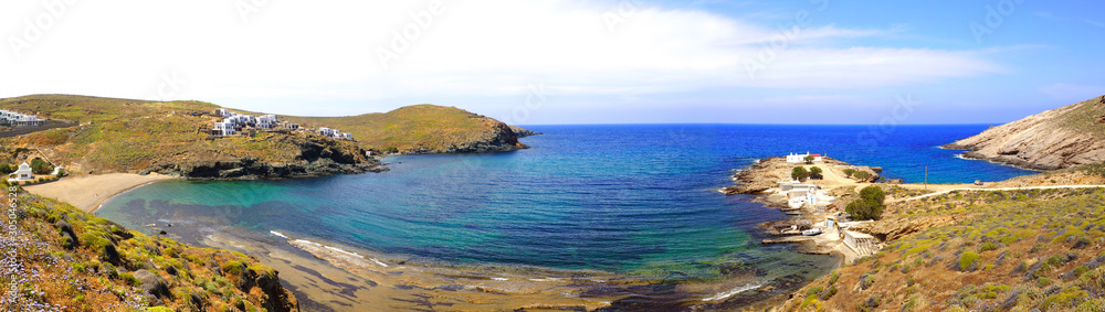 Merchia beach with its fishing port and the Chapel Saint Nicholas on the north side of Mykonos, famous Greek island in the heart of the Aegean Sea Merchia beach with its fishing port and the Chapel Saint Nicholas on the north side of Mykonos, famous Greek island in the heart of the Aegean Sea