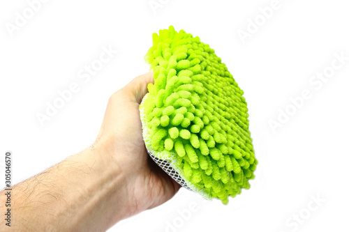 stylish sponge in hand on a white background for cars