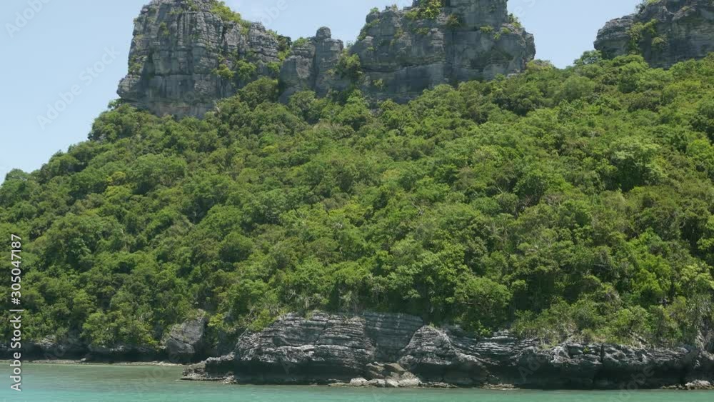 Group of Islands in ocean at Ang Thong National Marine Park near touristic Samui paradise tropical resort. Archipelago in the Gulf of Thailand. Idyllic turquoise sea natural background, copy space Group of Islands in ocean at Ang Thong National Marine Park near touristic Samui paradise tropical resort. Archipelago in the Gulf of Thailand. Idyllic turquoise sea natural background, copy space