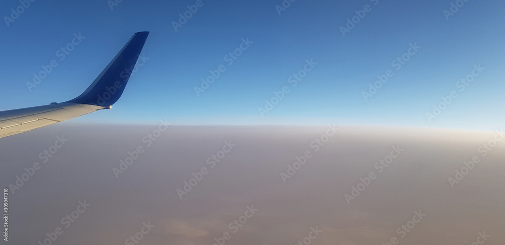 landscape above the clouds from airplane