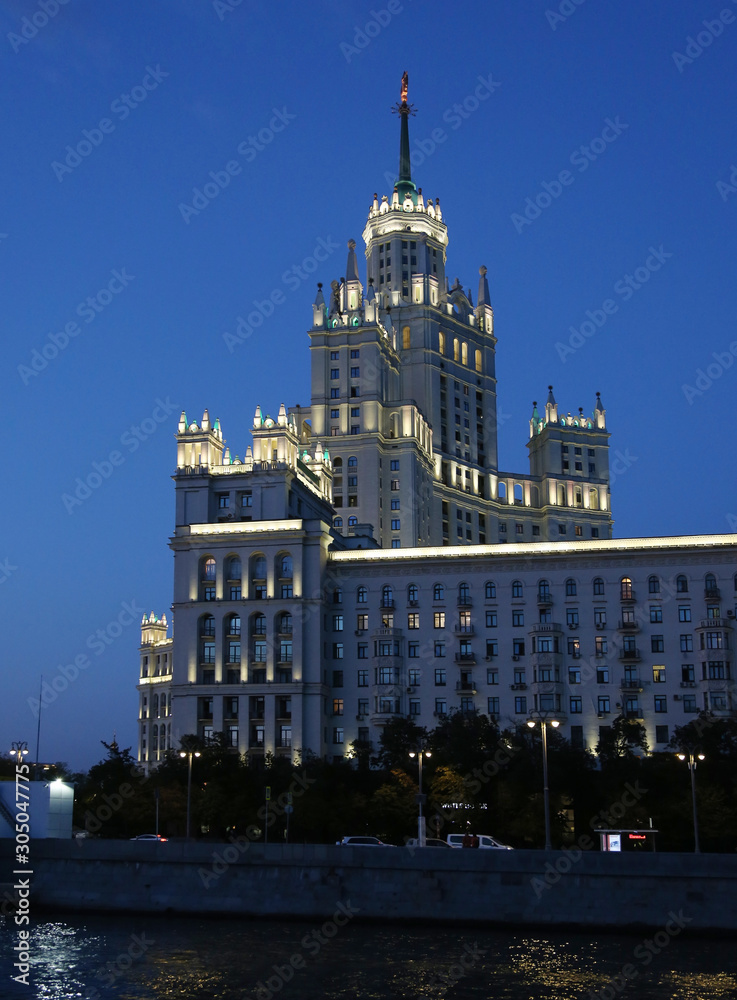 Naklejka premium Moscow. High-rise building on Kotelnicheskaya embankment. Night view from the Moscow river