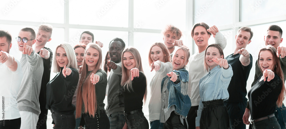 Fototapeta premium group of young like-minded people pointing at you