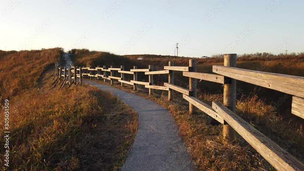 4K Point of view foot path and wooden fence with high mound hill 4K Point of view foot path and wooden fence with high mound hill