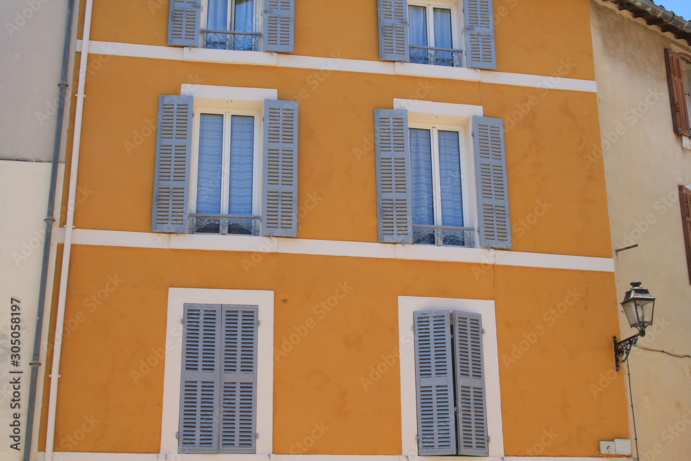 Obraz premium Traditional houses with colorful facades and wooden window shutters in the historic center of Martigues, the Little Venice of Provence, France 