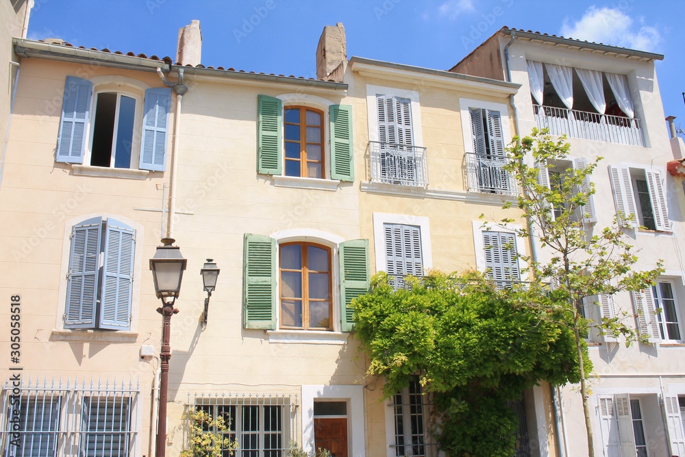 Obraz premium Traditional houses with colorful facades and wooden window shutters in the historic center of Martigues, the Little Venice of Provence, France 