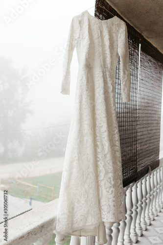 Close up photo of beautiful elegant lace wedding dress. 