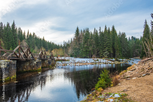 Bridge over Vydra and its surroundings, beautiful river in National Park of the Czech Bohemian forests, Czech Republic. photo