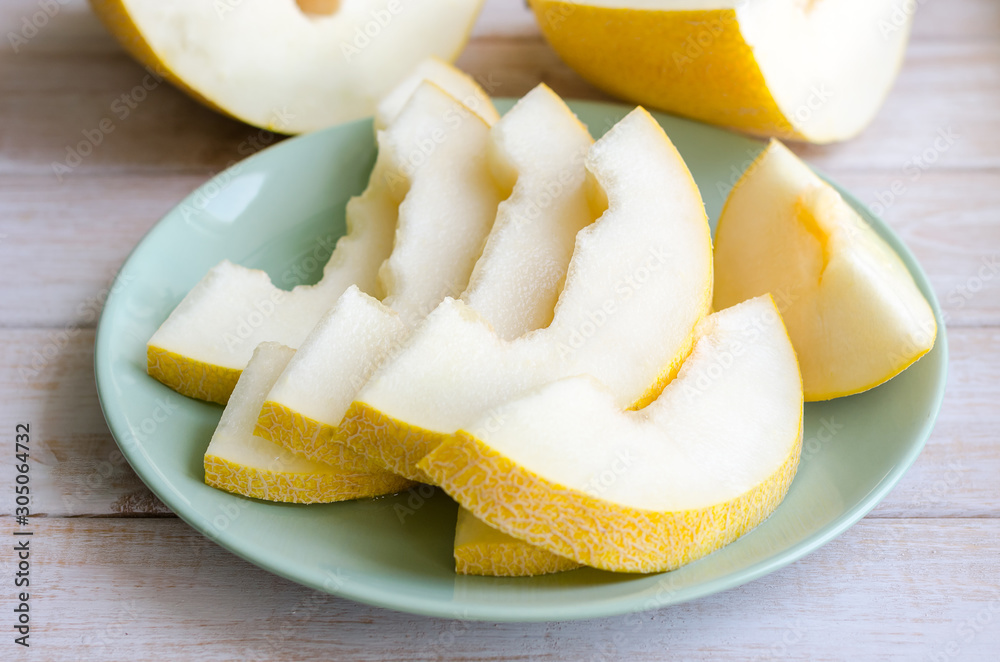 Sliced juicy ripe melon on a plate. Sliced juicy ripe melon on a plate.