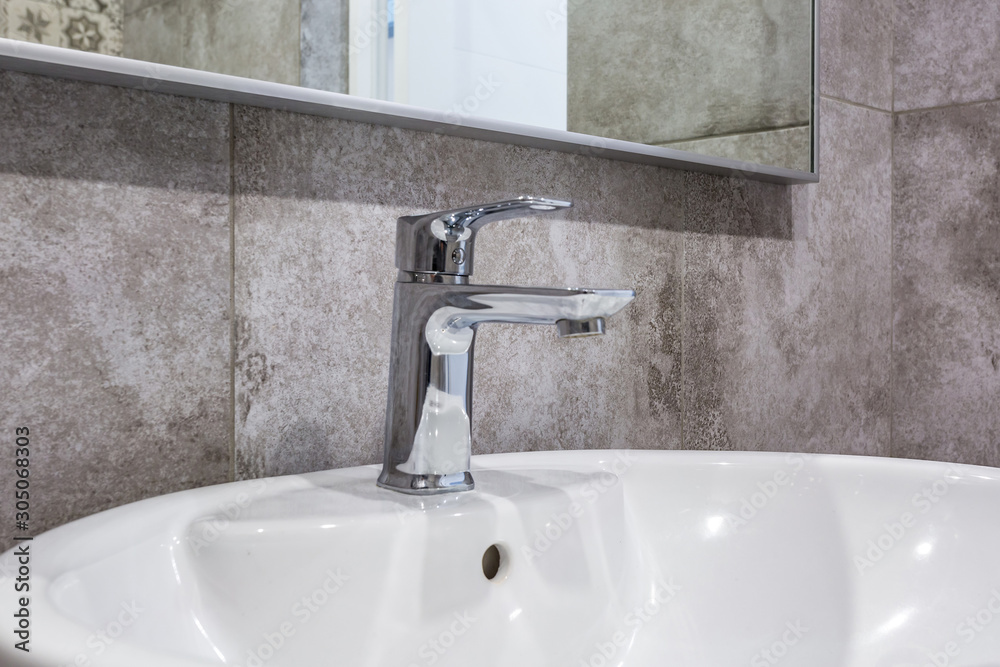 steel water tap sink with faucet in expensive loft bathroom steel water tap sink with faucet in expensive loft bathroom
