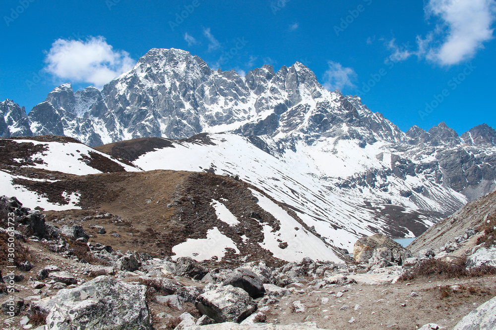View of Pharilapche mountain (6017 meters) in Sagarmatha national park in Himalayas. The lake is visible on the right at the foot of the mountain. Route to Everest base camp through Gokyo lakes.