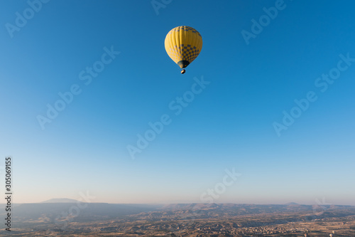 Hot air balloon flying over Cappadocia, Turkey. © 22Imagesstudio