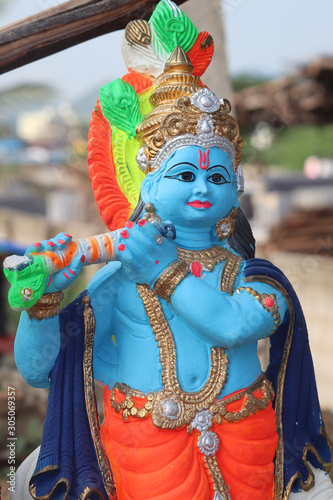 Colorful Plaster Of Paris Statue Of Lord Krishna Playing Flute