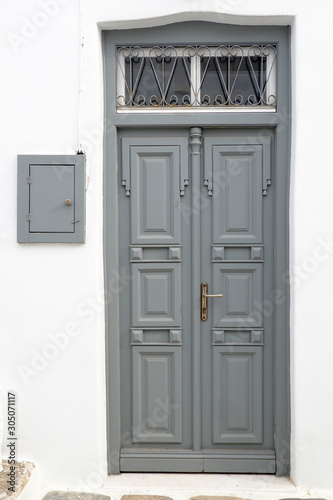 one of the charms of Mykonos, Greek Cycladic island in the heart of the Aegean Sea, are the beautiful colored doors of the houses of the narrow streets of the ancient city