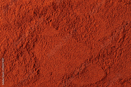 Fotografija Red paprika powder background and texture
