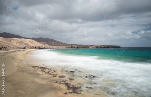 Long exposure of playa papagayo beach, lanzarote. © cliff