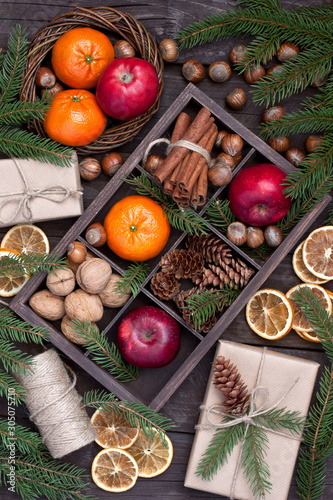 Christmas fruits on wooden background