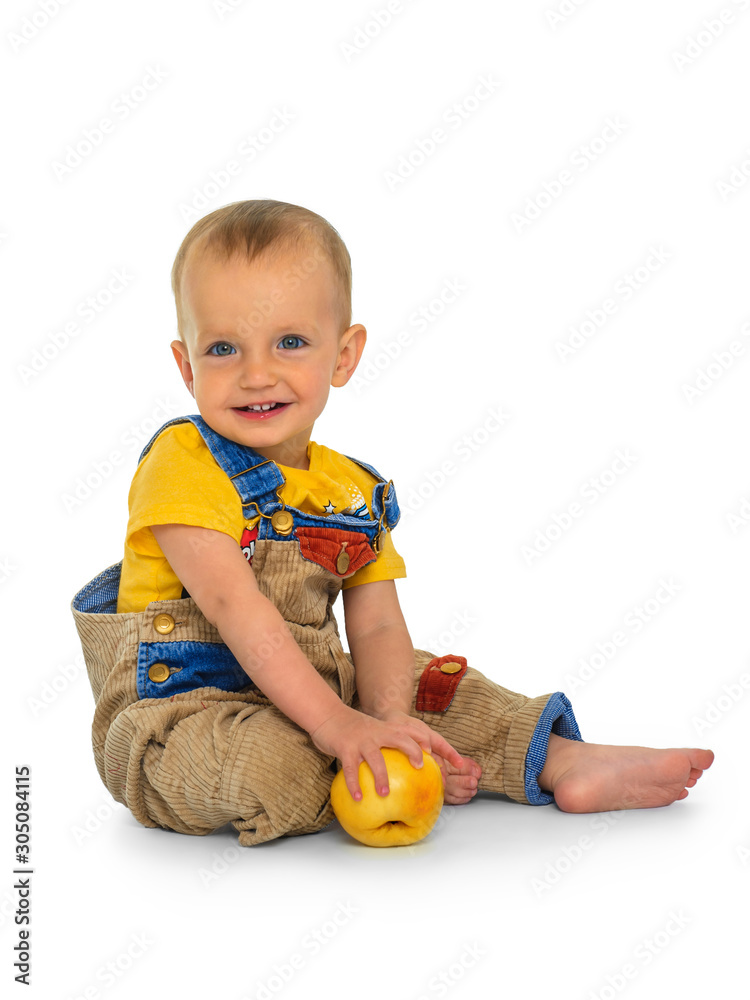 Smiling cute baby boy with apple on isolated background. Smiling cute baby boy with apple on isolated background.