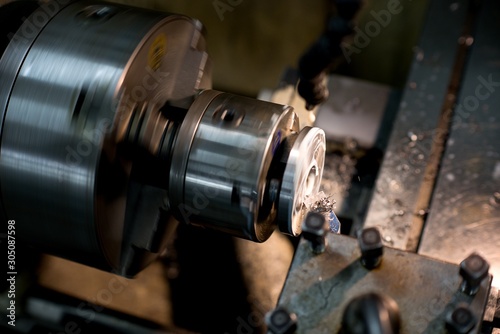 Old metal lathe machine, retro machine background.